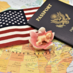 US Map, flag, passport, and small ceramic baby