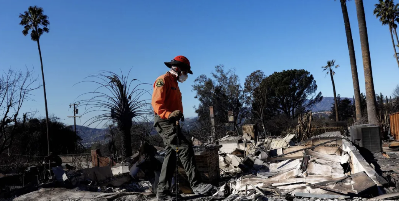 search and rescue worker goes through damaged homes