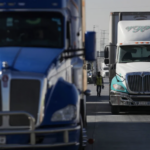 18-wheelers semi trucks waiting to unload shipping containers