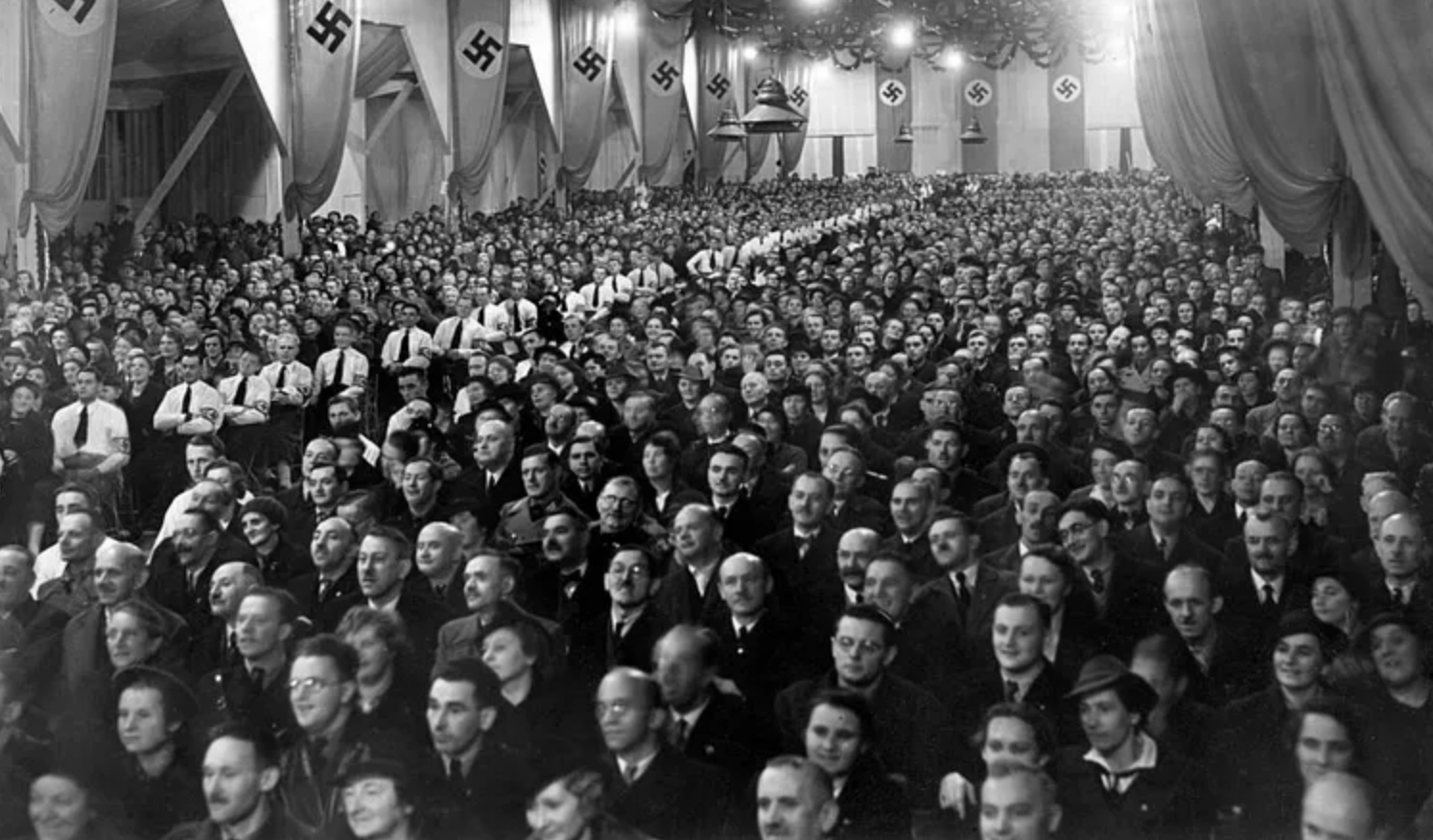 Germans crowding room in Reichenberger, listening to Joseph Goebbels speech