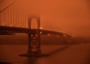 Golden Gate Bridge under a smoke-filled sky at midday