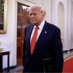 President Trump walks in White House Corridor