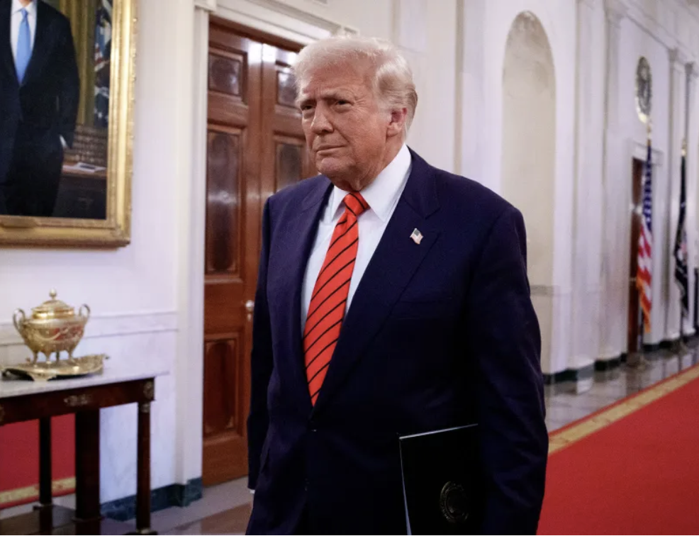 President Trump walks in White House Corridor