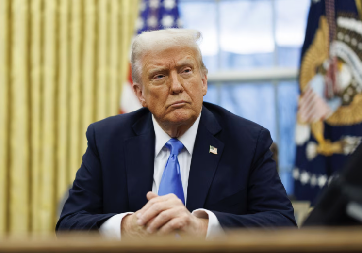 Trump sits frowning in oval office