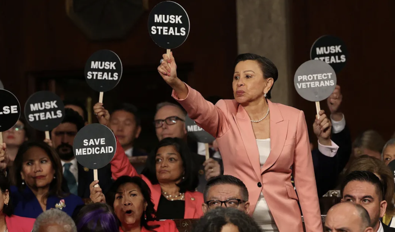 Dems wave protest signs during Trumps SOTU speech