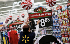 Walmart worker puts up Christmas decorations