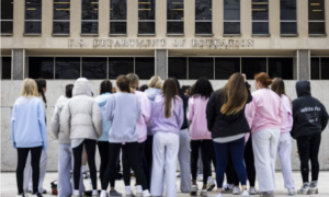 Women-girls stand outside the Education Department in Washington