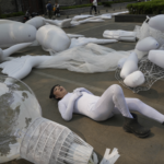 Earth Day display with human part of sea garbage