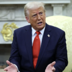 Trump in Oval Office speaks and gestures with hands
