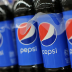 Bottles of Pepsi on grocery store shelves