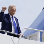 Trump fist pump as he boards Air Force One
