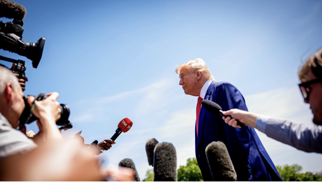 Trump on stage leans toward reporters