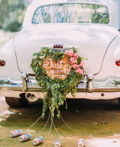 Vintage wedding car with just married sign and cans attached.jpg