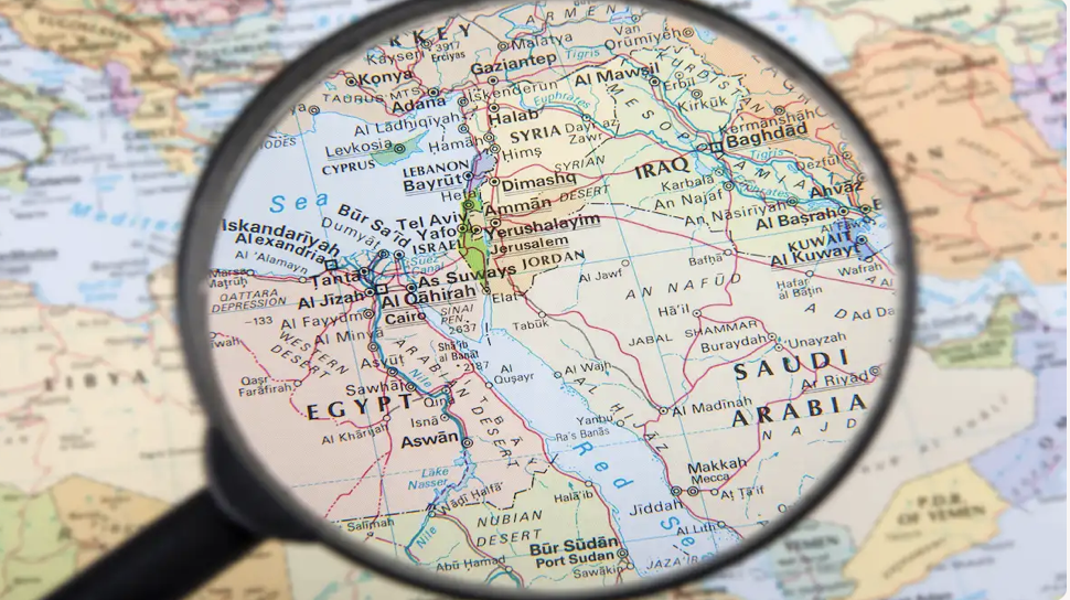 World Map with magnifying glass over Middle East