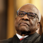 Supreme Court Justice Clarence Thomas scowls