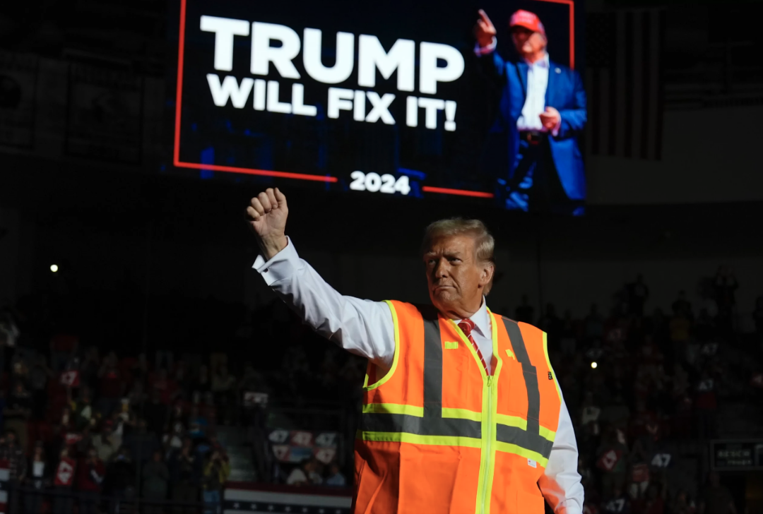 Trump campaigns wearing dump truck driver safety vest