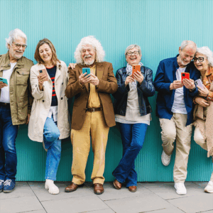 Boomers in a row on their mobile devices