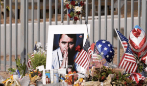 Memorial to Charlie Kirk by a Fence