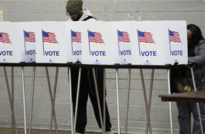 2 black people at voting stands